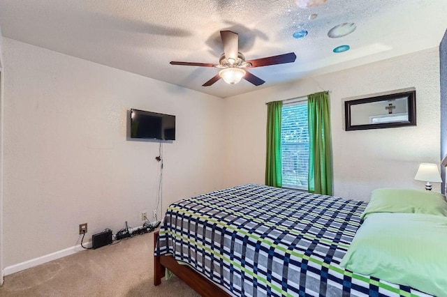 1229 Twin Cv, Kyle, TX 78640 - carpeted bedroom with a textured ceiling and ceiling fan