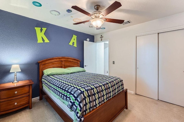 1229 Twin Cv, Kyle, TX 78640 - bedroom with a closet, carpet flooring, and a ceiling fan