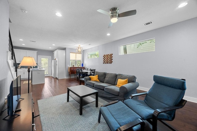 312 Delmar Ave Unit B, Austin, TX 78752 - living area with recessed lighting, dark wood finished floors, a ceiling fan, stairs, and a chandelier