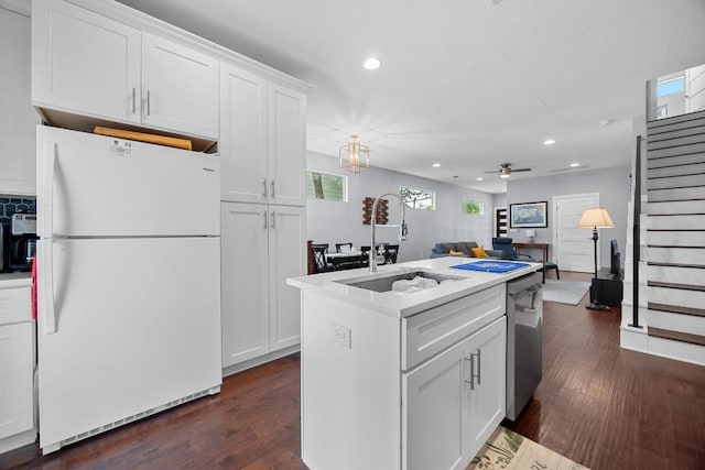312 Delmar Ave Unit B, Austin, TX 78752 - kitchen featuring freestanding refrigerator, recessed lighting, stainless steel dishwasher, white cabinetry, and light countertops