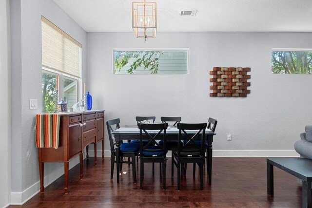 312 Delmar Ave Unit B, Austin, TX 78752 - dining room featuring dark wood-style floors and a chandelier