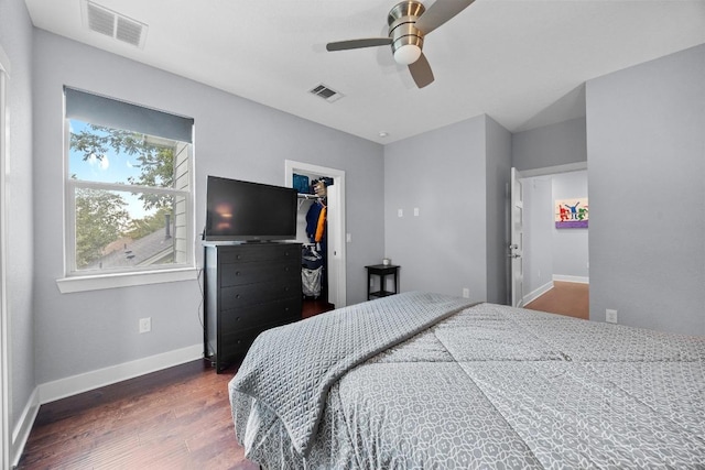 312 Delmar Ave Unit B, Austin, TX 78752 - bedroom featuring wood finished floors, a spacious closet, a closet, and ceiling fan
