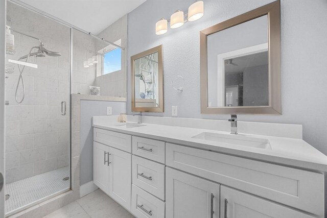 312 Delmar Ave Unit B, Austin, TX 78752 - full bath featuring double vanity, marble finish floors, and a stall shower