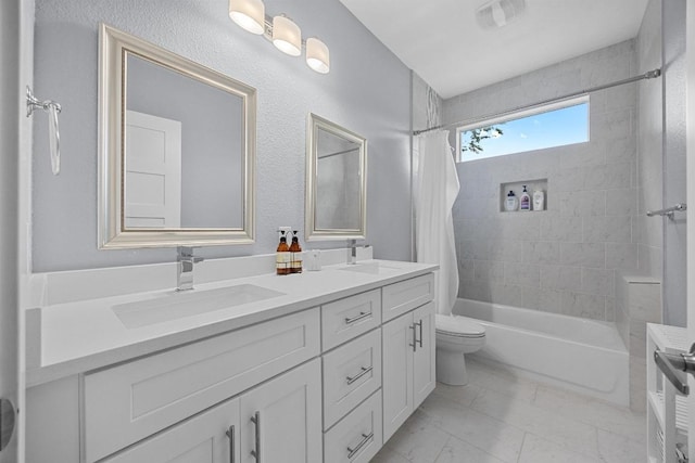 312 Delmar Ave Unit B, Austin, TX 78752 - bathroom featuring double vanity, shower / tub combo, and marble look tile flooring