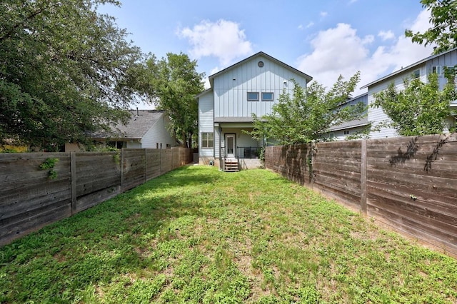 312 Delmar Ave Unit B, Austin, TX 78752 - back of property featuring board and batten siding and a fenced backyard