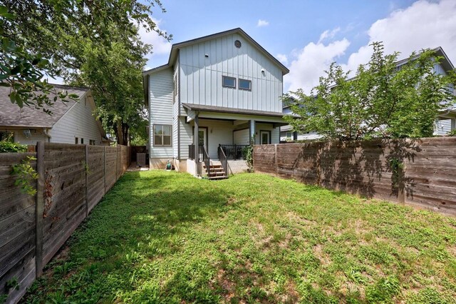 312 Delmar Ave Unit B, Austin, TX 78752 - back of property featuring board and batten siding and a fenced backyard