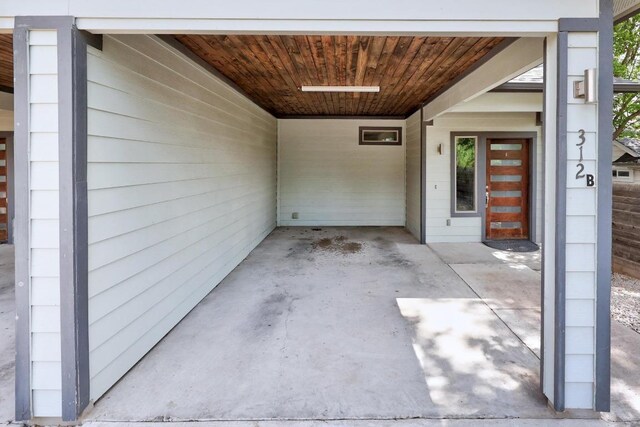 312 Delmar Ave Unit B, Austin, TX 78752 - doorway to property featuring an attached carport