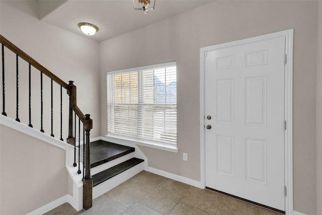 1416 Bichon Bnd, Austin, TX 78748 - foyer with healthy amount of natural light, stairs, and light tile patterned floors