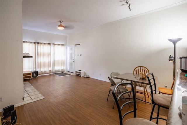 807 W 25th St Unit 102, Austin, TX 78705 - dining room featuring crown molding and wood finished floors