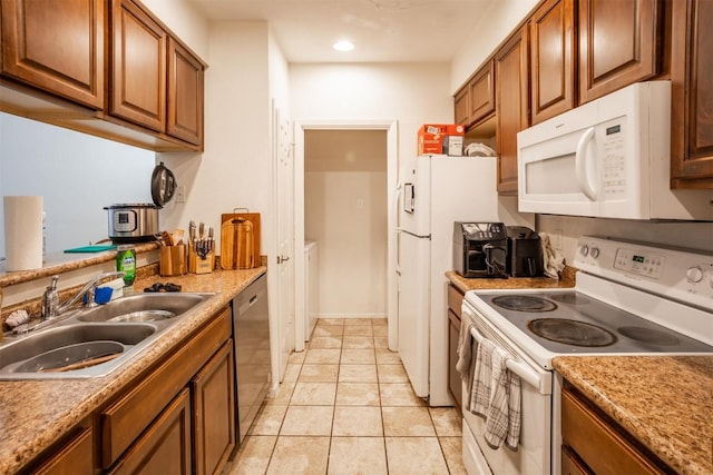 807 W 25th St Unit 102, Austin, TX 78705 - kitchen featuring white appliances, brown cabinets, light tile patterned flooring, light countertops, and recessed lighting