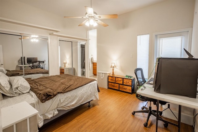 807 W 25th St Unit 102, Austin, TX 78705 - bedroom featuring light wood finished floors, an office area, and multiple closets