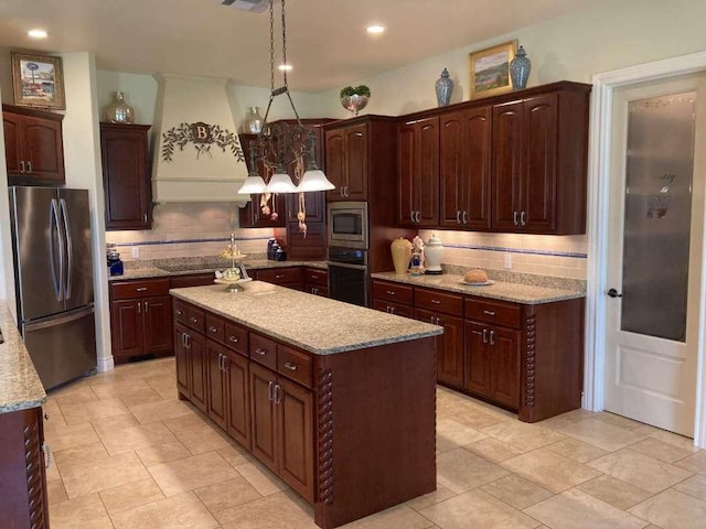 1621 Legends Pkwy, Kingsland, TX 78639 - kitchen featuring stainless steel appliances, a center island, backsplash, custom exhaust hood, and recessed lighting