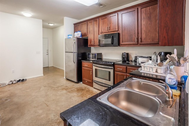 910 W 25th St Unit 403, Austin, TX 78705 - kitchen with appliances with stainless steel finishes, dark countertops, and finished concrete flooring