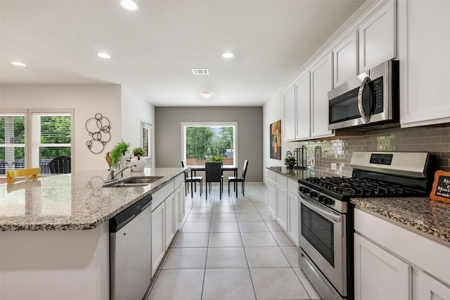 1116 La Conterra Blvd, Georgetown, TX 78626 - kitchen featuring appliances with stainless steel finishes, decorative backsplash, white cabinets, and recessed lighting