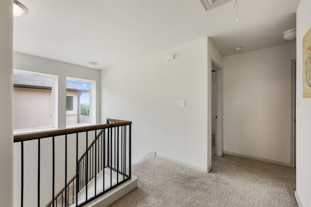 1116 La Conterra Blvd, Georgetown, TX 78626 - hallway with attic access, an upstairs landing, and carpet flooring