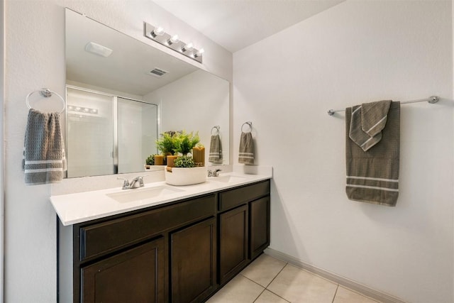 1116 La Conterra Blvd, Georgetown, TX 78626 - full bath featuring double vanity, tile patterned floors, and an enclosed shower