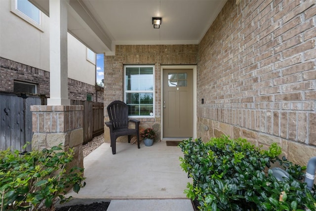 1116 La Conterra Blvd, Georgetown, TX 78626 - property entrance featuring brick siding and a patio area