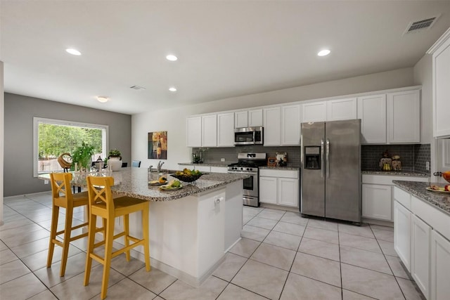 1116 La Conterra Blvd, Georgetown, TX 78626 - kitchen with appliances with stainless steel finishes, tasteful backsplash, light stone countertops, and recessed lighting