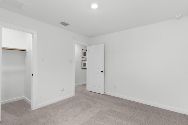 2705 Sage Ranch Dr Unit 19, Leander, TX 78641 - unfurnished bedroom with light colored carpet, a walk in closet, and a closet