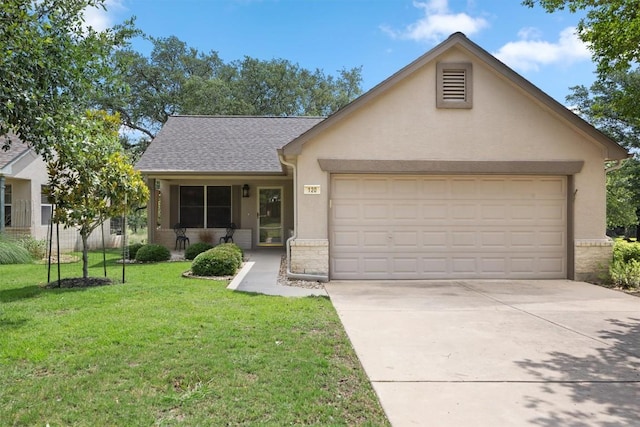 120 Plover Pass, Georgetown, TX 78633 - view of front of house featuring stucco siding, an attached garage, driveway, a front lawn, and a shingled roof