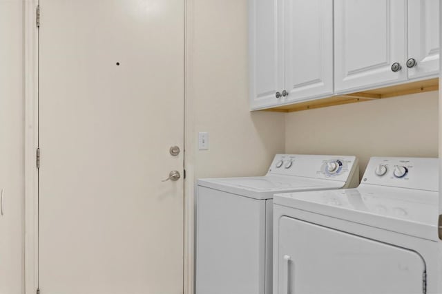 120 Plover Pass, Georgetown, TX 78633 - laundry room featuring independent washer and dryer and cabinet space