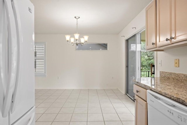 120 Plover Pass, Georgetown, TX 78633 - kitchen featuring white appliances, a chandelier, hanging light fixtures, and light tile patterned floors