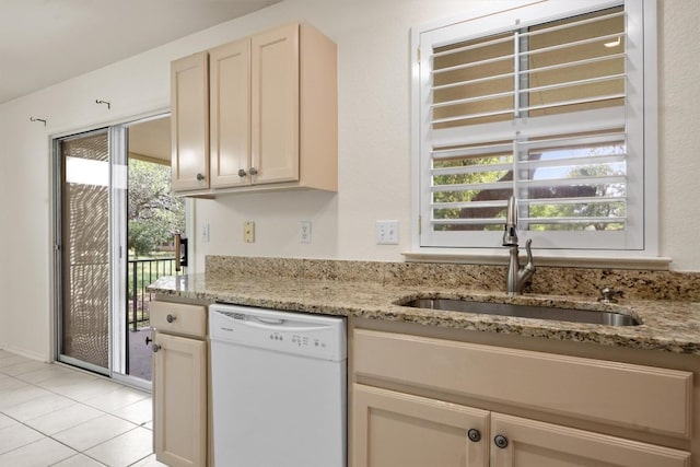120 Plover Pass, Georgetown, TX 78633 - kitchen with dishwasher, light stone countertops, and light tile patterned floors