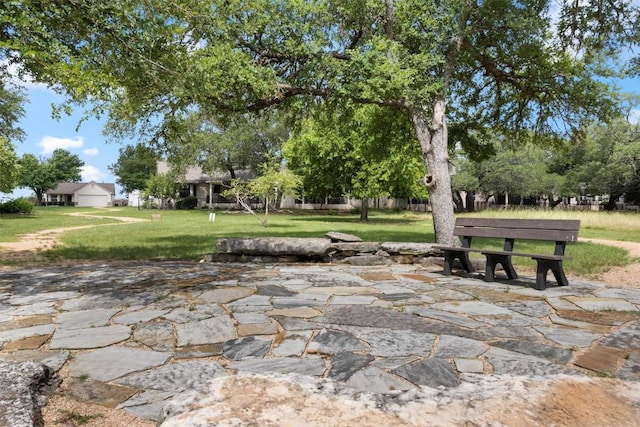 120 Plover Pass, Georgetown, TX 78633 - view of property's community featuring a yard and a patio area