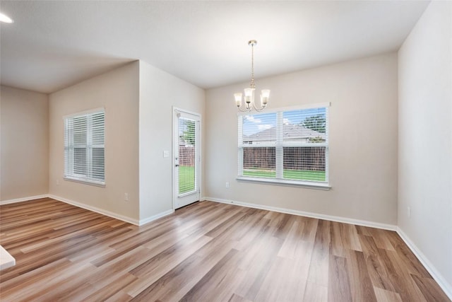 2533 Buffalo Ford Ct, Georgetown, TX 78628 - empty room featuring a chandelier and wood finished floors