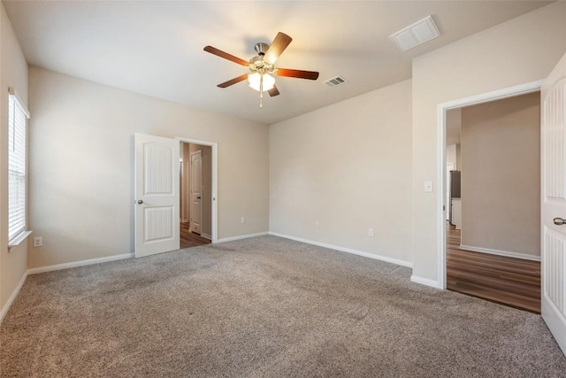 2533 Buffalo Ford Ct, Georgetown, TX 78628 - unfurnished bedroom with multiple windows, carpet flooring, and a ceiling fan