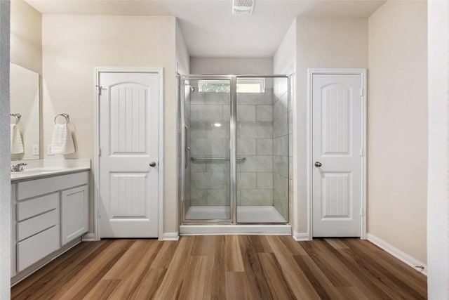 2533 Buffalo Ford Ct, Georgetown, TX 78628 - full bathroom with wood finished floors, vanity, and a shower stall