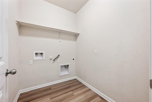 2533 Buffalo Ford Ct, Georgetown, TX 78628 - laundry area with gas dryer hookup, wood finished floors, hookup for an electric dryer, and washer hookup