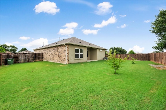 2533 Buffalo Ford Ct, Georgetown, TX 78628 - rear view of house with a fenced backyard