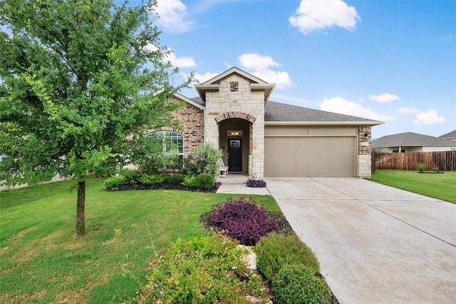 2533 Buffalo Ford Ct, Georgetown, TX 78628 - french provincial home featuring a garage, stone siding, driveway, and brick siding
