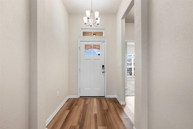 2533 Buffalo Ford Ct, Georgetown, TX 78628 - entrance foyer featuring wood finished floors and a chandelier