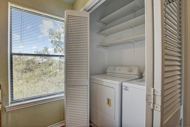 8200 Neely Dr Unit 116, Austin, TX 78759 - washroom with washing machine and dryer and a textured wall