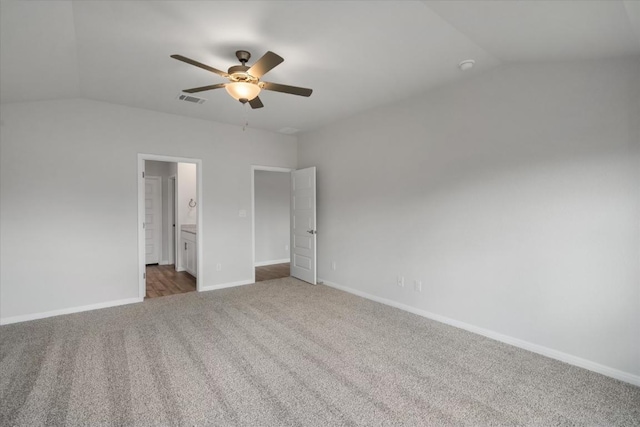 10406 Mager Ln, Hutto, TX 78634 - unfurnished bedroom featuring vaulted ceiling, carpet, ensuite bathroom, and a ceiling fan
