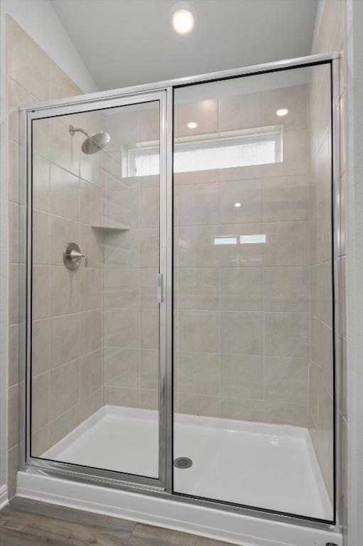 10406 Mager Ln, Hutto, TX 78634 - bathroom featuring a shower stall, healthy amount of natural light, and recessed lighting