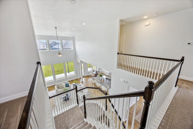 19612 Abigail Way, Pflugerville, TX 78660 - staircase featuring carpet, a towering ceiling, a ceiling fan, and recessed lighting