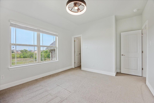 19612 Abigail Way, Pflugerville, TX 78660 - empty room with light carpet and a smoke detector