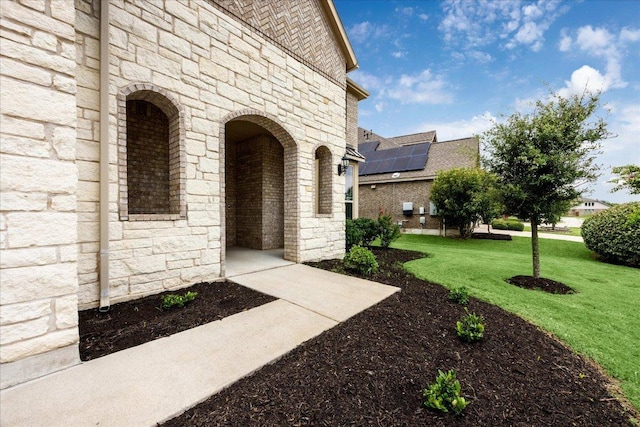 19612 Abigail Way, Pflugerville, TX 78660 - view of exterior entry with stone siding and a yard