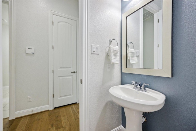 19612 Abigail Way, Pflugerville, TX 78660 - bathroom featuring wood finished floors and a textured wall