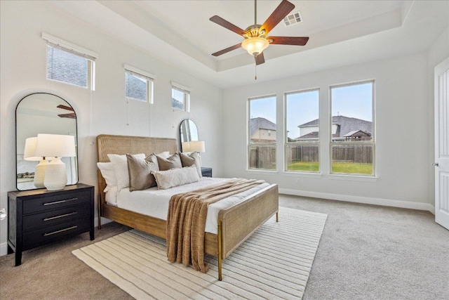 19612 Abigail Way, Pflugerville, TX 78660 - bedroom with light carpet, a raised ceiling, and ceiling fan