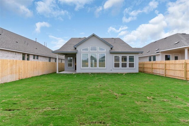 20500 Ed Townes Ter, Manor, TX 78653 - back of house featuring a fenced backyard, roof with shingles, and stucco siding