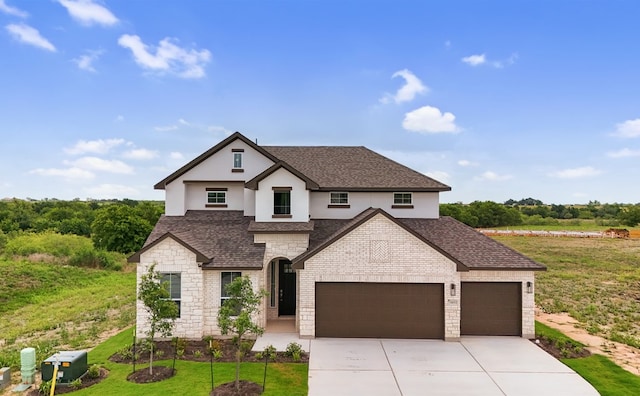 20500 Ed Townes Ter, Manor, TX 78653 - french country home with stone siding, a shingled roof, an attached garage, driveway, and a front yard