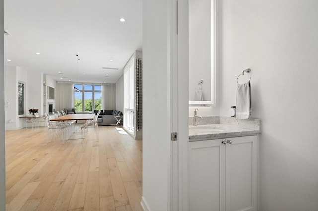 2608 Watkins Way, Austin, TX 78746 - hallway featuring light wood-type flooring and recessed lighting