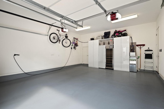 2608 Watkins Way, Austin, TX 78746 - garage with a garage door opener and wine cooler