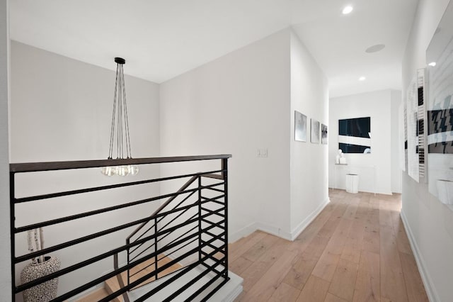 2608 Watkins Way, Austin, TX 78746 - corridor featuring an upstairs landing, hardwood / wood-style floors, a chandelier, and recessed lighting