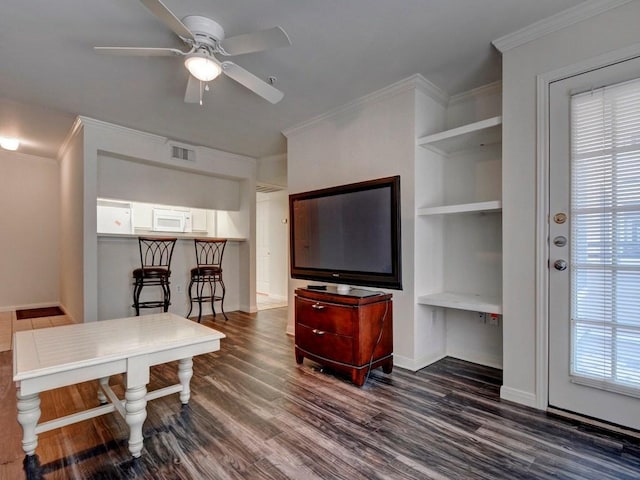501 W 26th St Unit 102, Austin, TX 78705 - living room featuring dark wood-style flooring, ceiling fan, crown molding, and built in features