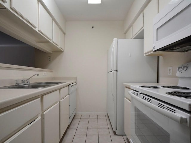 501 W 26th St Unit 102, Austin, TX 78705 - kitchen with white appliances, white cabinetry, light countertops, and light tile patterned floors
